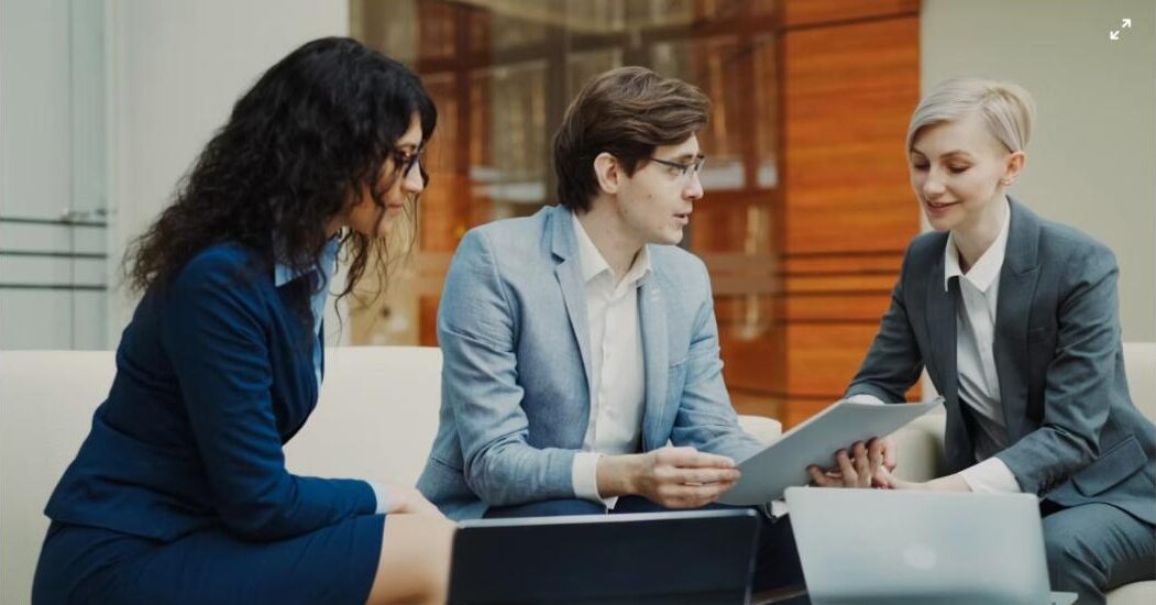 Professionals reviewing data on a tablet - UAE Competition Framework 2026