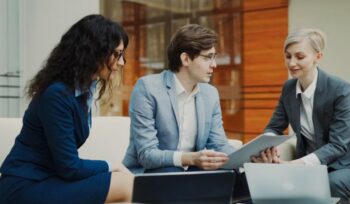 Professionals reviewing data on a tablet - UAE Competition Framework 2026