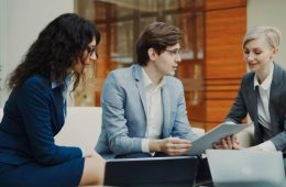 Professionals reviewing data on a tablet - UAE Competition Framework 2026