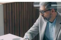 Professional working at desk on a laptop - UAE eInvoicing 2026