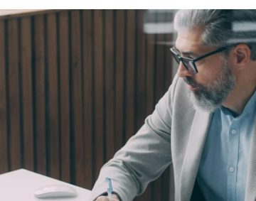 Professional working at desk on a laptop - UAE eInvoicing 2026